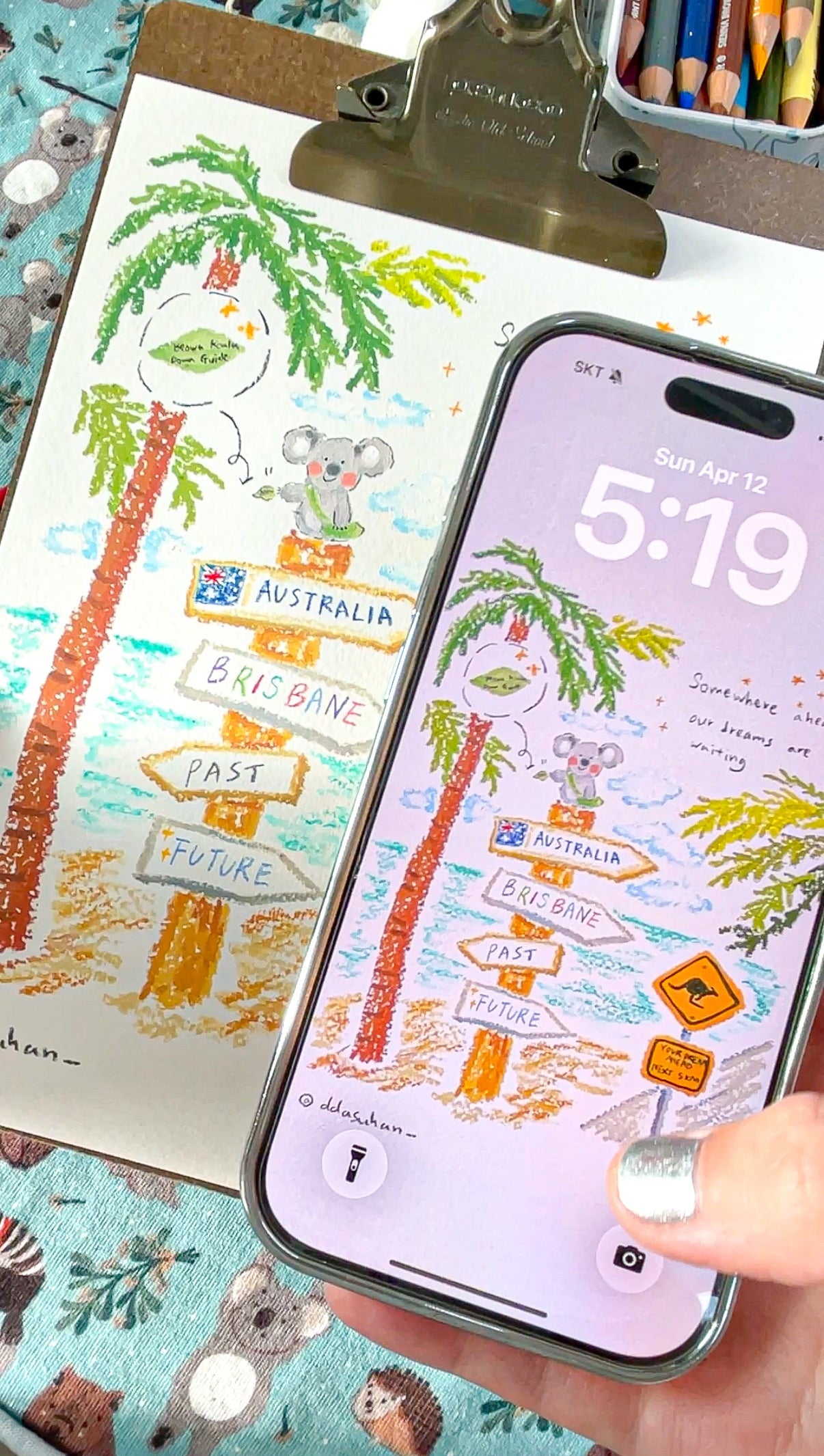 Phone displaying a map of Australia with a hand holding it, on a colorful background.